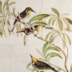 A close-up of the finished ceramic tile mural. The detailed illustration and soft, natural colors bring a touch of botanical elegance to what would otherwise be a plain surface.