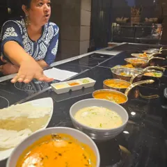 Explaining the different dishes laid out for a tasting at The Lodhi, New Delhi. From the light Pandra Rassa to the spicy curries, each dish tells a story about the flavours of Maharashtra.