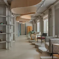 We conceptualized the JOSMO furniture store in Worli as an experiential gallery. This view captures the fluid design, where sculptural concrete platforms and flowing overhead installations guide visitors through a curated symphony of textures, objects, and contemporary furniture pieces.