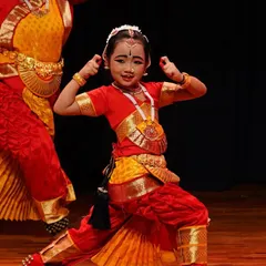 The joy of dance shines on this young student's face. Abhinaya is not just about serious emotions; it is also about expressing happiness and celebration.