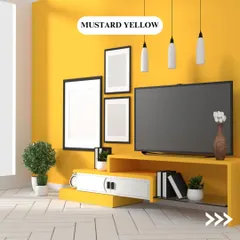 A vibrant mustard yellow brings energy and warmth to this entertainment area. It's a bold choice that works well as an accent wall to create a cheerful and modern focal point.