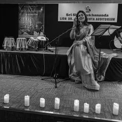 A black and white shot of the "Phir Le Aayi Dil" concert, with the stage lit by candles. This image captures the intimate and atmospheric setting we created for an evening of soulful ghazals and music.