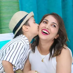 Capturing those pure, unscripted moments of love, like a son giving his mom a happy kiss during a party. These candid shots are often the most treasured.