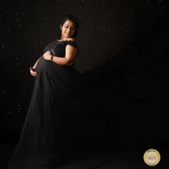 For a truly dramatic portrait, we use flowing fabrics and a dark, starry background to create a sense of wonder and elegance.
