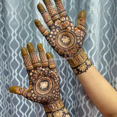 Another look at the lotus mandala design, this time with the henna paste still on. The dark paste promises a beautiful, rich stain.