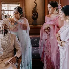 The groom's sisters perform the Sehra Bandi ritual, a beautiful and significant tradition in Punjabi weddings. I capture these family-centric moments with care.