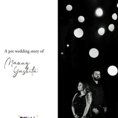 A stylish black and white portrait of a couple against a backdrop of bokeh lights, creating a glamorous and modern pre-wedding story.