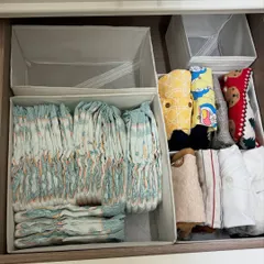 A drawer organized for baby essentials. We created dedicated compartments for diapers, wipes, and bibs, ensuring everything is within arm's reach during changing time.