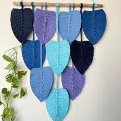 A similar cascading leaf design, this time in a cool palette of blues and purples. This piece brings a sense of calm and serenity to any room.