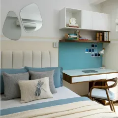 We designed this study area right next to the bed, making it a convenient spot for late-night work or reading. The white and teal color scheme creates a fresh and calming atmosphere.