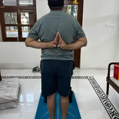This client, who has been dealing with Gout for 15 years, is now able to do a reverse prayer pose. This demonstrates a significant improvement in his shoulder and wrist mobility.