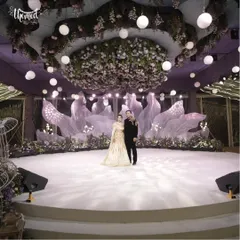 A stage set for forever. For this elegant engagement, I designed a dreamy, romantic backdrop with ethereal fabrics and a breathtaking floral canopy. It’s all about creating a magical space where your love story can take center stage.