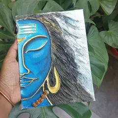 A textured painting of Shiva, where I used a thick medium to create the flowing hair and serene facial features. The contrast between the calm blue face and the dynamic silver hair is what I love most.