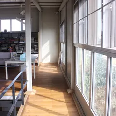 Sunlight streams into our upper-level workspace through large windows. We prioritized natural light in our own studio design to create a bright and healthy environment for our architects.