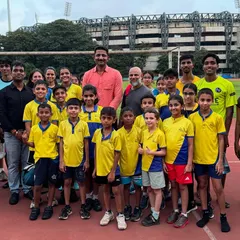 A group photo with Dr. Manoj Reddy, who recognized our club for its sound coaching principles and application of biomechanics. This validation of our methods means the world to us.