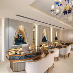 A closer look at the individual consultation areas, where arched alcoves with draped curtains reveal curated jewellery displays. This design creates a sense of discovery and personal attention within the larger showroom.
