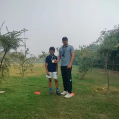 Posing with a proud student and his medal after a successful competition. My youth sports coaching is designed to build both skill and confidence.
