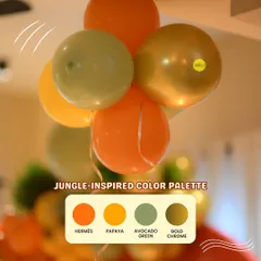 A jungle-inspired color palette for a "Wild One" first birthday. We used shades of Hermes orange, papaya, avocado green, and gold chrome to create an adventurous and unique look.