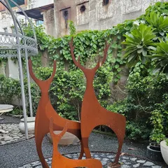 These minimalist, rust-finished deer sculptures add a touch of modern art to a garden setting. They are designed to weather beautifully over time.