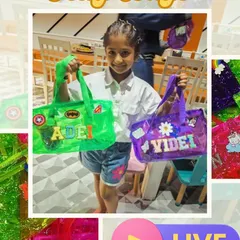 A happy party guest holding up her two new custom jelly bags. Our live station allows kids to get creative and design bags that show off their unique style with names and patches.