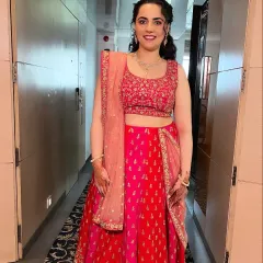 A full-length shot of the bridesmaid, looking happy and ready to celebrate. The makeup is designed to last through a long day of festivities.