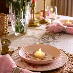 Happy Diwali. A simple place setting made special with a tiny crochet tea light holder, adding a warm and festive glow to each plate.