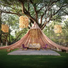 Our signature offering is a one-of-a-kind mandap tent nestled under a magnificent, sprawling tree. It’s an intimate and truly romantic setting for exchanging your vows.
