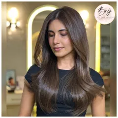 The shine on this ashy brunette look is a result of healthy coloring techniques. The cool tones are rich and deep, creating a polished finish.