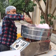 The candy floss machine is always a favorite, especially with kids. An attendant spins fluffy, sweet candy floss on sticks for guests to enjoy on the spot.