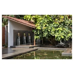 The Rishi Pavilion, where busts of the institution's founders are displayed. The design uses a combination of modern architectural forms, natural materials, and serene water features to create a contemplative space for visitors.