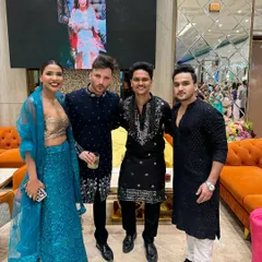 Wedding guests dressed in our coordinated black ethnic wear. Each kurta has a different embroidery pattern and cut, from a simple textured design to a more elaborate embellished piece.