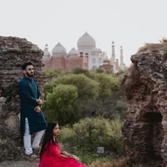 A classic pre-wedding portrait with the Taj Mahal in the distance. I love finding unique angles at iconic locations to create a romantic and timeless photograph.