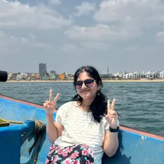 A happy client enjoying a sunny day on our summer boat ride experience. It's a perfect way to relax and celebrate a special occasion with a view of the Chennai coastline.