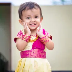 Such a happy smile! The outfit is designed to be comfortable, using soft lining under the silk so that children feel happy and can be themselves while wearing my creations.