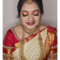 A gorgeous muhurtham look for a client who loves color. You'll learn how to blend vibrant eyeshadows and pair them with traditional jewelry for a complete and festive bridal appearance.