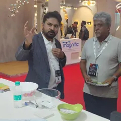 Here, we are in discussion with an interested visitor, explaining the long-term value and technology behind our home automation systems. These interactions are key to understanding our clients' needs.