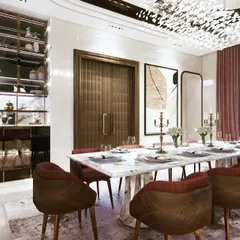 This dining room combines luxurious materials for a grand statement. The design features a stunning marble-top table, rich leather chairs, a custom crockery unit, and a breathtaking crystal chandelier that elevates every meal into a special occasion.