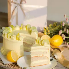 Light, fluffy, and deliciously tangy. This Lemon Cake features layers of moist, lemon-flavored cake and a rich lemon cream cheese frosting, garnished with lemon slices.