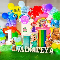 Here is another take on the popular Cocomelon theme, packed with details. It includes a rainbow backdrop, multiple character cutouts, themed pedestals, and a custom photo of the birthday baby integrated into the design.