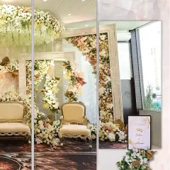 A closer look at the stunning floral stage we designed for an engagement. We used oversized white frames as a unique structural element, filling them with an abundance of white, cream, and blush flowers.