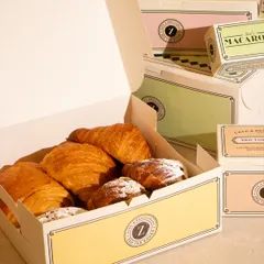 A box filled with an assortment of my freshly baked croissants and pastries. It's the perfect takeaway treat to share with family or colleagues.