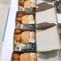 Our snack boxes are not just about traditional Indian fare. We also offer fun options like these boxes with a veg burger, cheese nuggets, and french fries, making them a hit at birthday parties and casual corporate events.