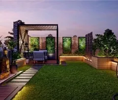 A 3D concept for a penthouse in Noida. This design features a spacious lawn, a cozy swing chair, and a covered seating area under a pergola, all illuminated to create a stunning evening view against the city skyline.