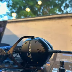 My custom DJ Kamra headphones resting on the mixer after a beautiful wedding night. I specialize in creating the perfect soundtrack for sangeet nights and receptions.