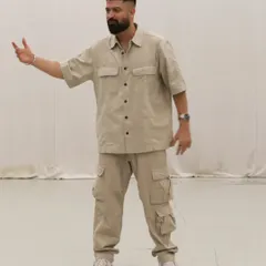 Guiding my students through a new piece of choreography. My teaching style is hands on, ensuring everyone understands the movement and the feeling behind it.