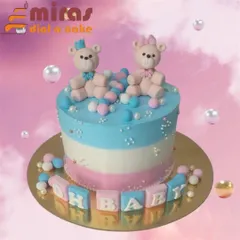 "Oh Baby!" This adorable gender reveal cake features pink and blue teddy bears on a striped cake, surrounded by colorful spheres. It's a sweet way to build anticipation for the big news.