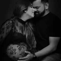 An intimate black and white portrait capturing the pure joy and connection between a couple. These close-up, emotional shots are timeless treasures that focus on the love story behind the bump.
