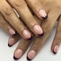 Simple, elegant, and a little bit dramatic. A deep, dark wine-colored tip gives this classic French manicure a sophisticated and modern edge.