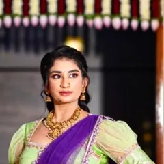 A vibrant and stylish half saree in lime green and royal purple. This unique color combination and the puff sleeve blouse make it a perfect outfit for a festive occasion or a friend's wedding.