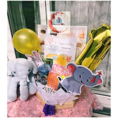 An adorable animal-themed birthday hamper for a little one. This custom gift includes a plush elephant, animal-themed puzzles and books, and a fun foil balloon to make their day extra special.